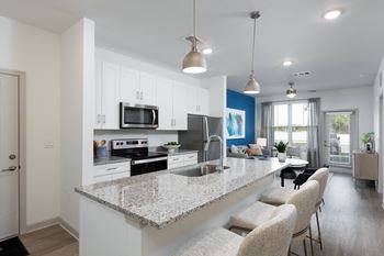 Gourmet kitchens with granite countertops & convenient islands